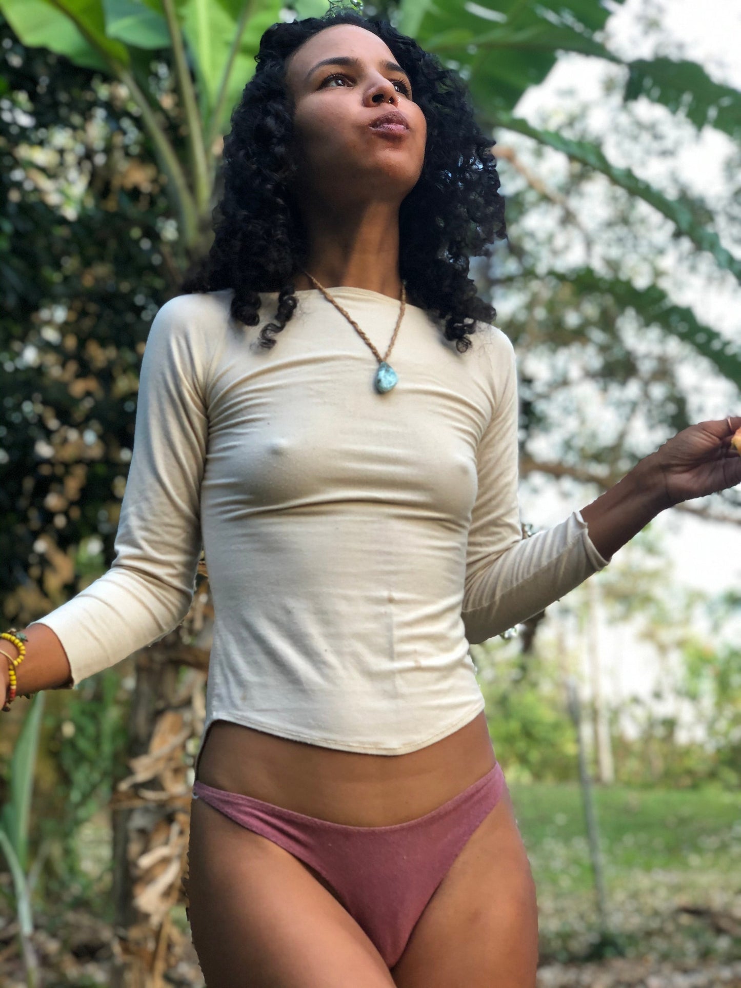 UV protective Shiva Bamboo thermoregulating sun protective and base layer top, fitted long sleeves slimming waistline design rounded feminine finish longer hem at the back