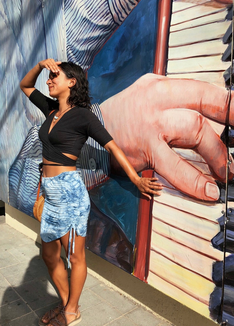 Wrap Hemp top in black , pictured here with the Jungle skirt in blue.